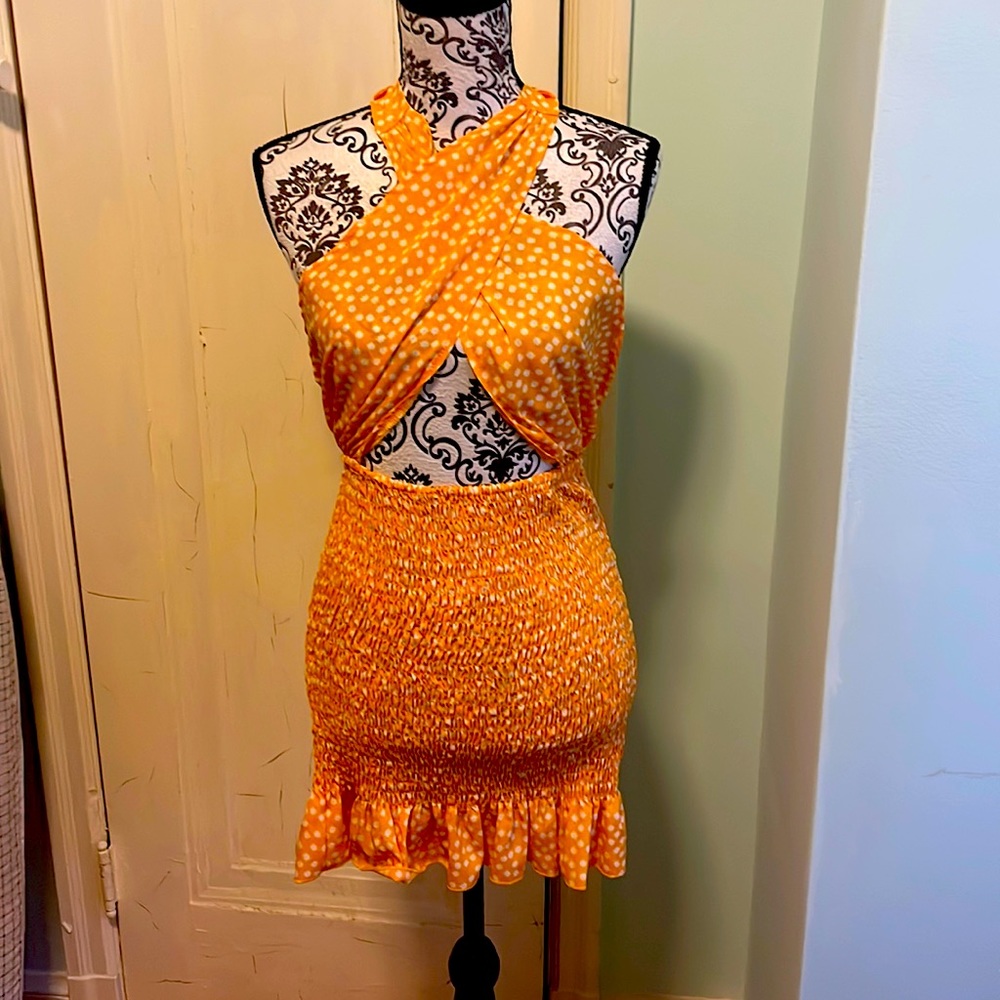 Yellow and white polka dot criss cross mini dress